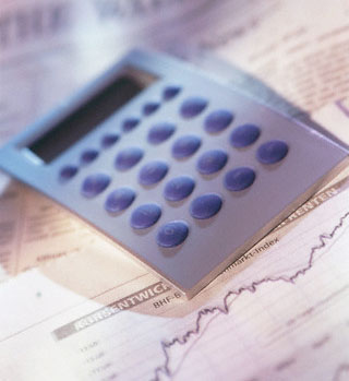 Services & Clientele Image of calculator on a newspaper page